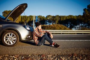 man-talking-phone-car