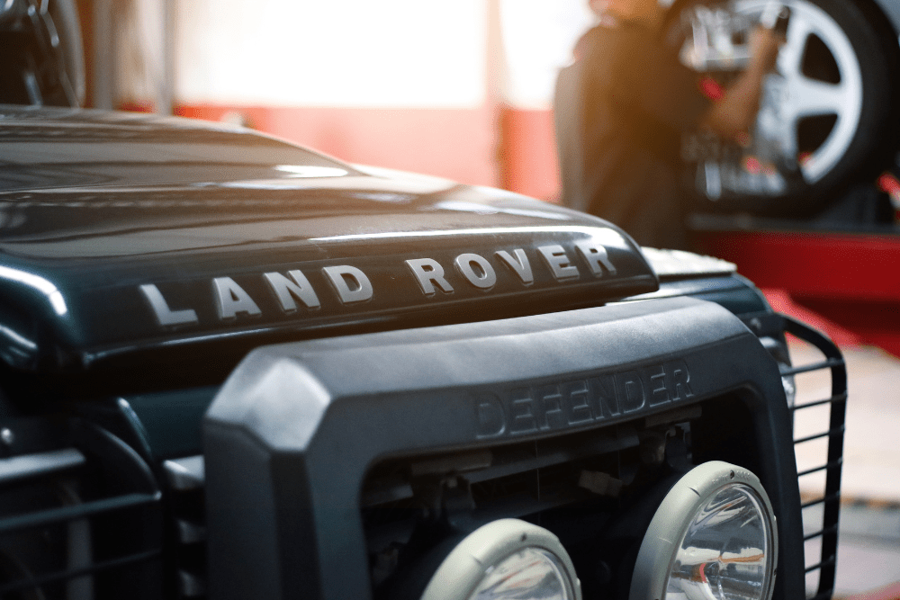 Land Rover Check Engine Light, Auto Repair in Englewood, CO at AutoImports of Denver. Close-up image of a Land Rover Defender in a repair shop.